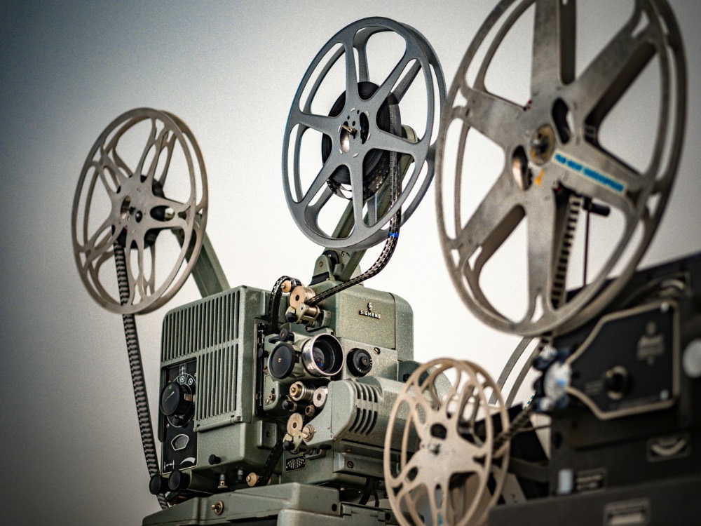 Vintage film projectors against a white background